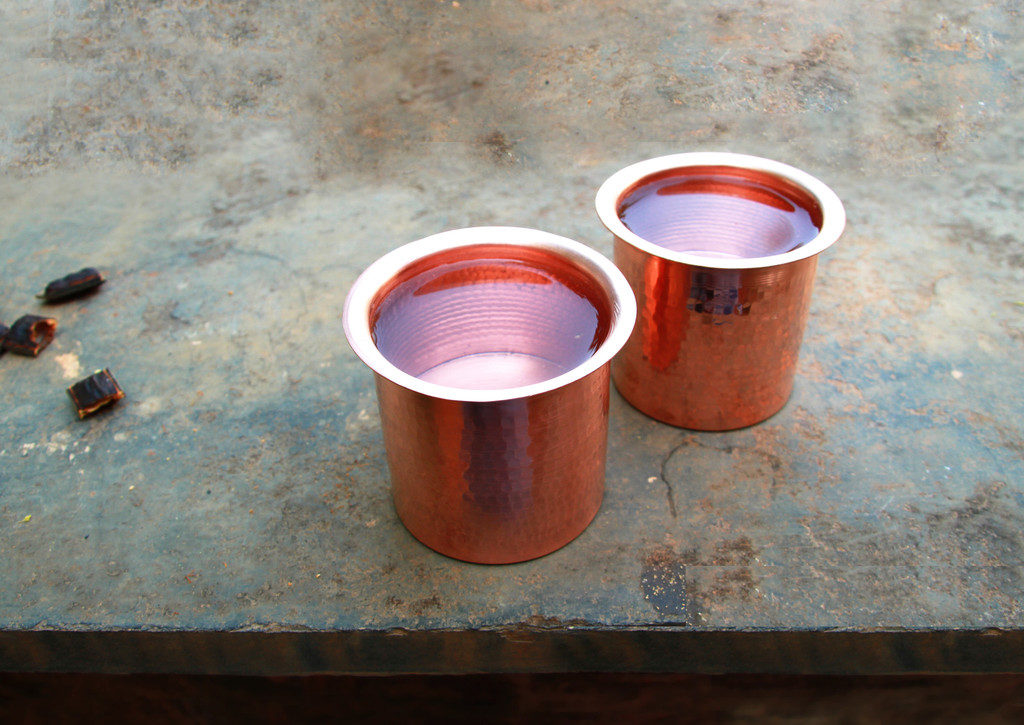 Copper charged water in copper glass